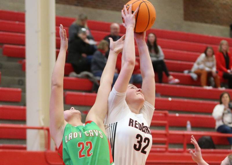 Metamora's Ella Russell grabs a rebound over L-P's Brianna Ruppert during the Ottawa Girls Holiday Tournament on Monday, Dec. 16, 2024 in Kingman Gym at Ottawa High School.
