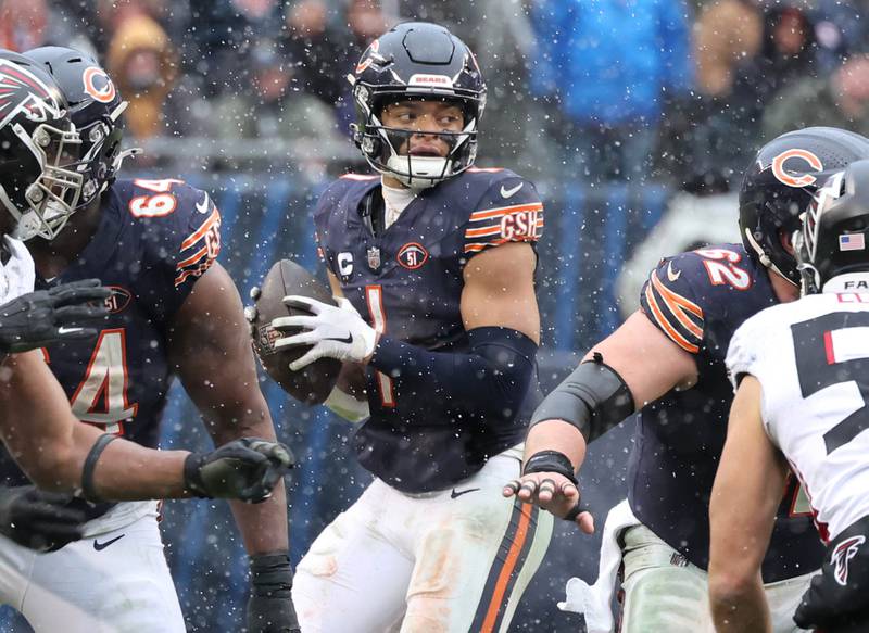 Chicago Bears quarterback Justin Fields looks for a receiver in the Atlanta Falcons secondary during their game Sunday, Dec. 31, 2023, at Soldier Field in Chicago.