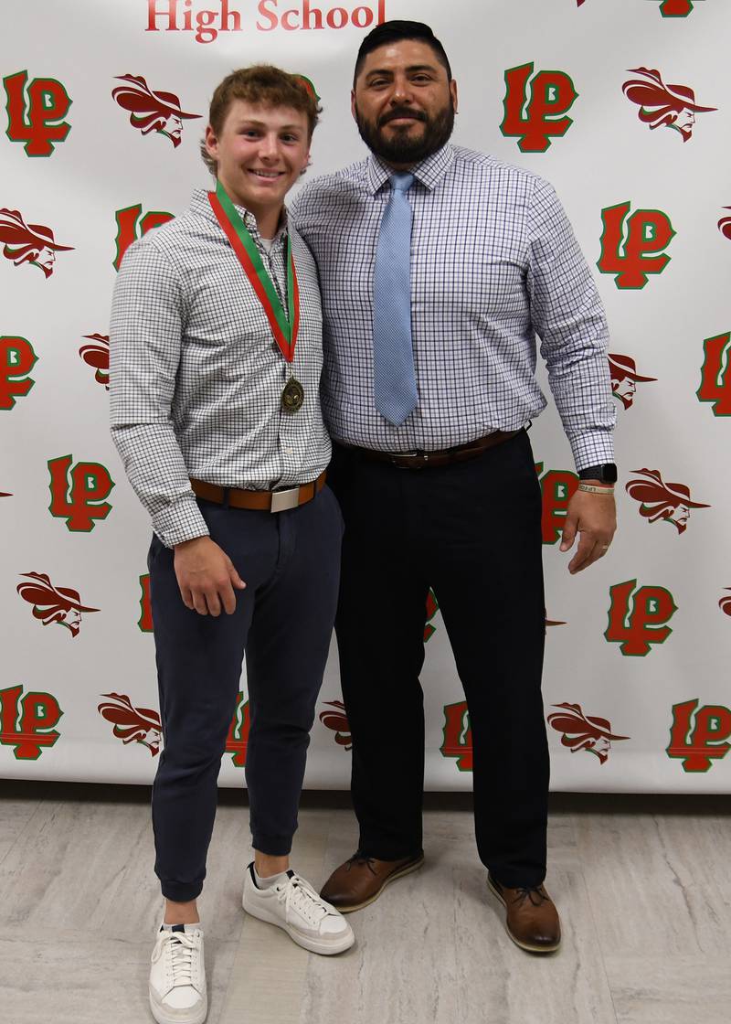 Mason Lynch (left) received the A.J. “Butch” Nowack Memorial Award, which is presented to a student-athlete who has shown excellence in football, combined with courage, determination, leadership and character.