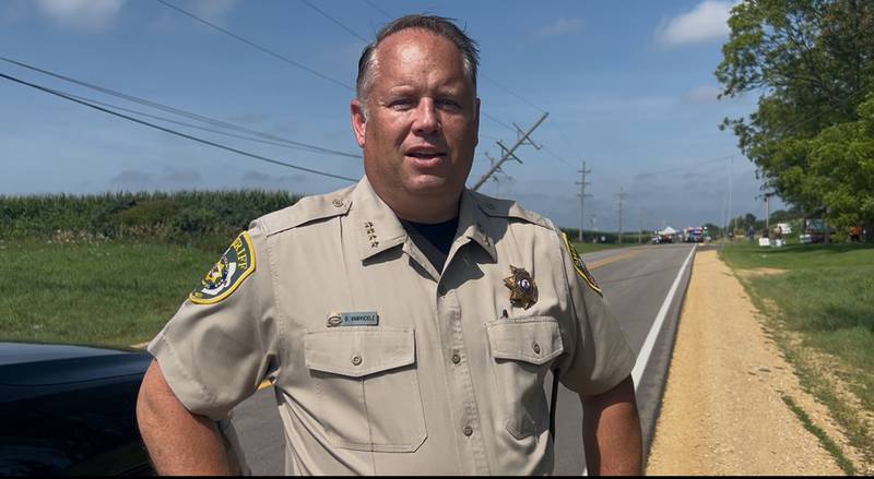 Ogle County Sheriff Brian VanVickle talks to Shaw Media following a fatal plane accident by the Ogle County Airport between Oregon and Mt. Morris on Tuesday, July 22, 2025. The pilot of a crop dusting plane was killed after hitting power lines near the airport. A section of Illinois Route 64 was closed for ComEd crews to repair the damage.