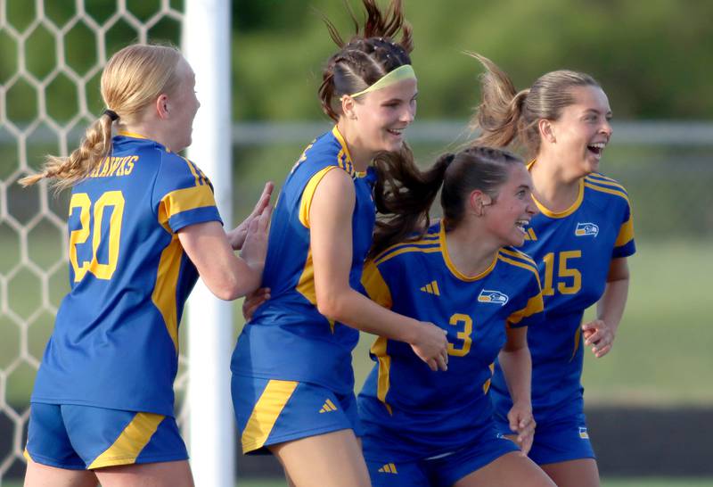 From left, Johnsburg’s Kayla Hiller, Liz Smith, Charlie Eastland and Lauren McQuiston celebrate the Skyhawks’ second goal against North Shore Country Day in IHSA Class 1A Sectional Title Game action at Richmond-Burton High School in Richmond on Tuesday, May 27, 2025.