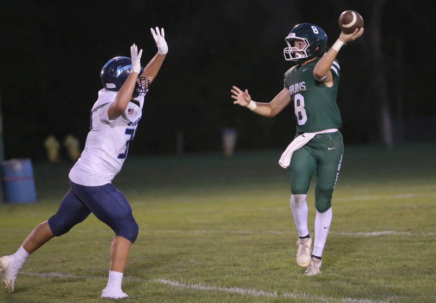 St. Bede quarterback Gino Ferrari lets go of a throw over the head of Bureau Valley's Blake Foster on Friday Aug. 29, 2025 at St. Bede Academy.
