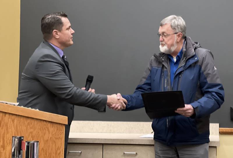 DeKalb County Administrator Brian Gregory recognized and thanked DeKalb County Coroner Dennis Miller for 40 years of service during the Jan. 17, 2024, DeKalb County Board meeting.