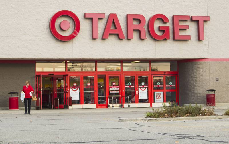 A customer exits the McHenry Target store on Tuesday, Nov 4. Target Corp. said Tuesday it plans to shutter 11 underperforming stores, including the one in McHenry, early next year. The move will affect 117 employees at the store, and the store will be closed Feb. 1.