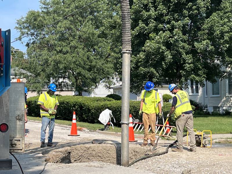 Crews conducting work on Thursday at the intersection Center and Moran streets in Joliet following a report of a sinkhole.