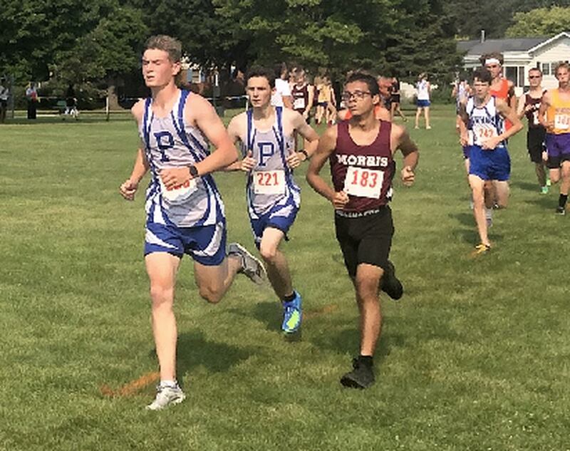 Princeton's Mack Williams and Christian Yepsen get out running early in Saturday's Coates Invitational at Zearing Park.