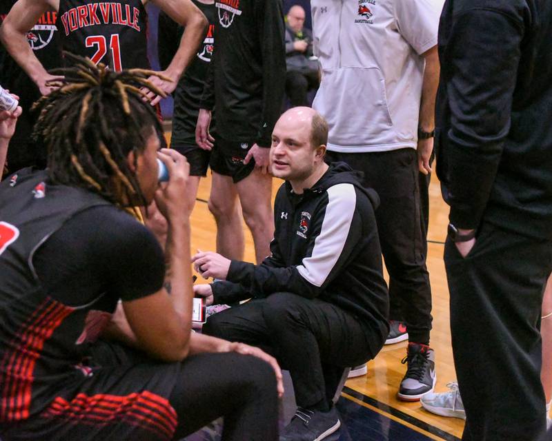 Yorkville's head coach John Holakovsky talks to the team on Friday Feb. 14, 2025, while traveling to take on Oswego East High School.