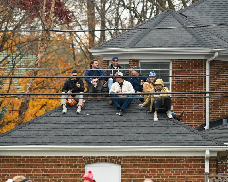 Spectators sit on top of the roof to watch the 6A semifinals game against Nazareth Academy and Fenwick on Saturday Nov. 22, 2025, held at Nazareth Academy High School in La Grange Park.
