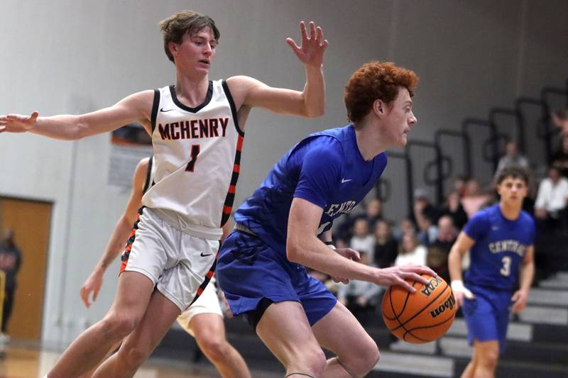 Burlington Central’s Patrick Shell moves past McHenry’s Dylan Hurckes  in varsity boys basketball on Tuesday, Feb. 4, 2025, at  McHenry High School  in McHenry.