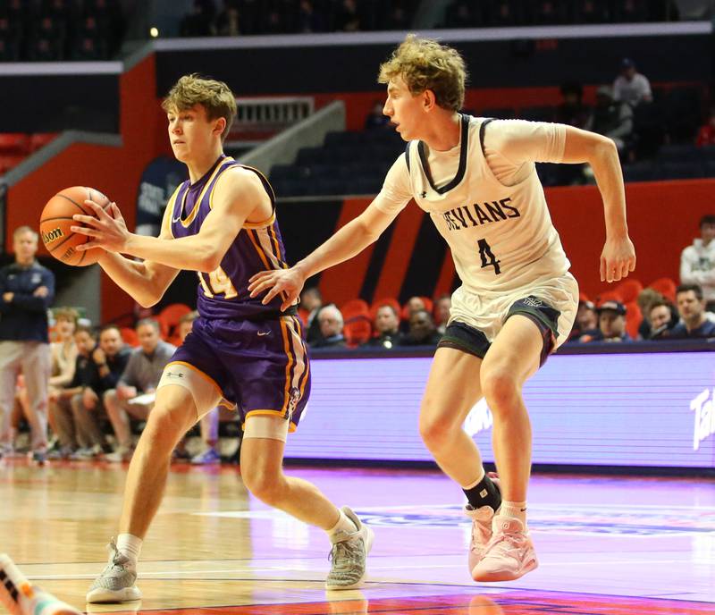 Downers Grove North's Max Haack looks to pass the ball in front of New Trier's Colby Smith in the Class 4A state third place game on Friday, March 10, 2023 at the State Farm Center in Champaign.