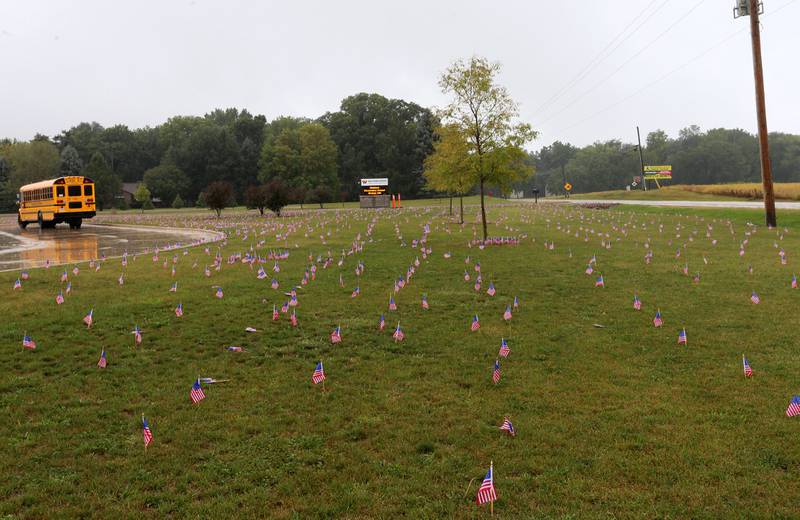 Waltham School placed 2,977 flags outside the school lawn to remember the lives lost in the 9/11 attacks on Monday, Sept. 11, 2023 in Utica.