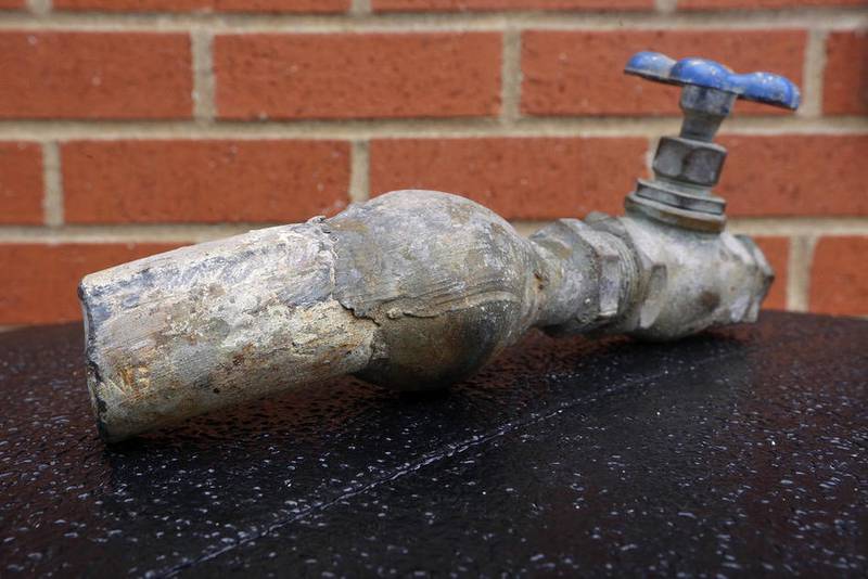 In this Wednesday, March 9, 2016 photo, city officials display an example of the lead pipes in Galesburg, Ill. An Associated Press analysis of federal data shows that nearly 1,400 water systems serving millions of Americans have exceeded the federal lead standard at least once during the last three years. In Galesburg, Ill., lead levels have exceeded the federal standard in 22 out of 30 testing periods since 1992.