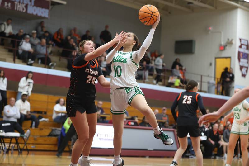 Providence’s Liv Anderson draws the shooting foul against Washington in the Class 3A Kankakee Super-Sectional game on Monday, March 3, 2026 in Kankakee.