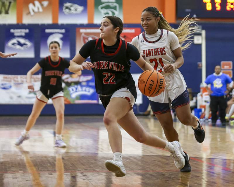 Yorkville's Sydney McCabe (22) drives to the basket during their basketball game between Yorkville at Oswego, Feb 7, 2026 in Oswego.