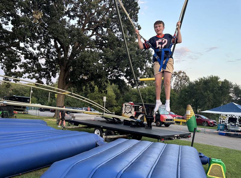 Grace Knutson of Oglesby bounces on a trampoline during the Taste of the Illinois Valley festival on Saturday, Aug. 3, 2024 at Centennial Park in Peru.