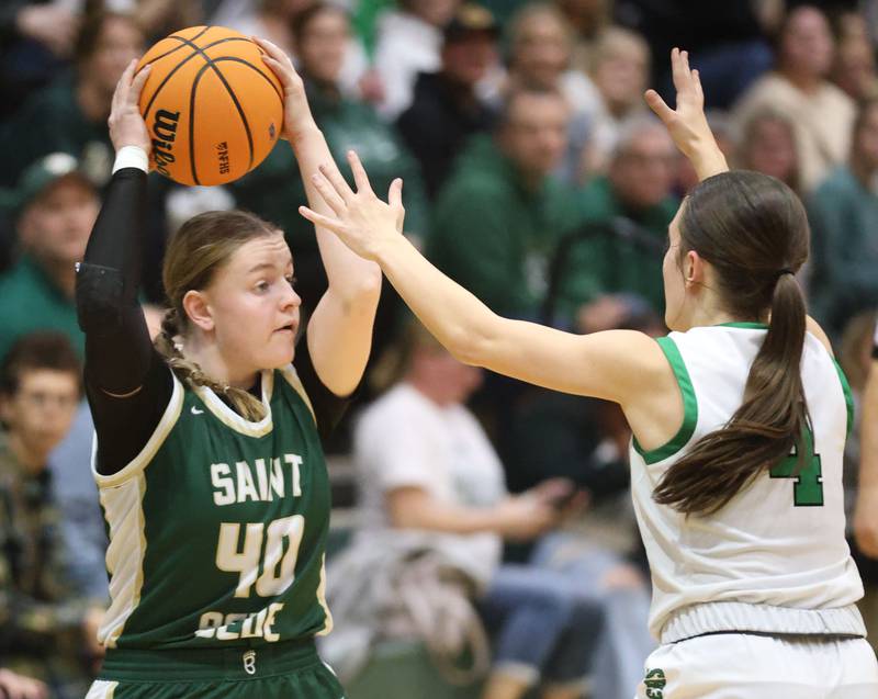 St. Bede's Ashlan Heersink looks to pass the ball around Alleman's Jillian Hoffman during the Class 2A Regional finals on Thursday, Feb. 19, 2026 at St. Bede Academy.