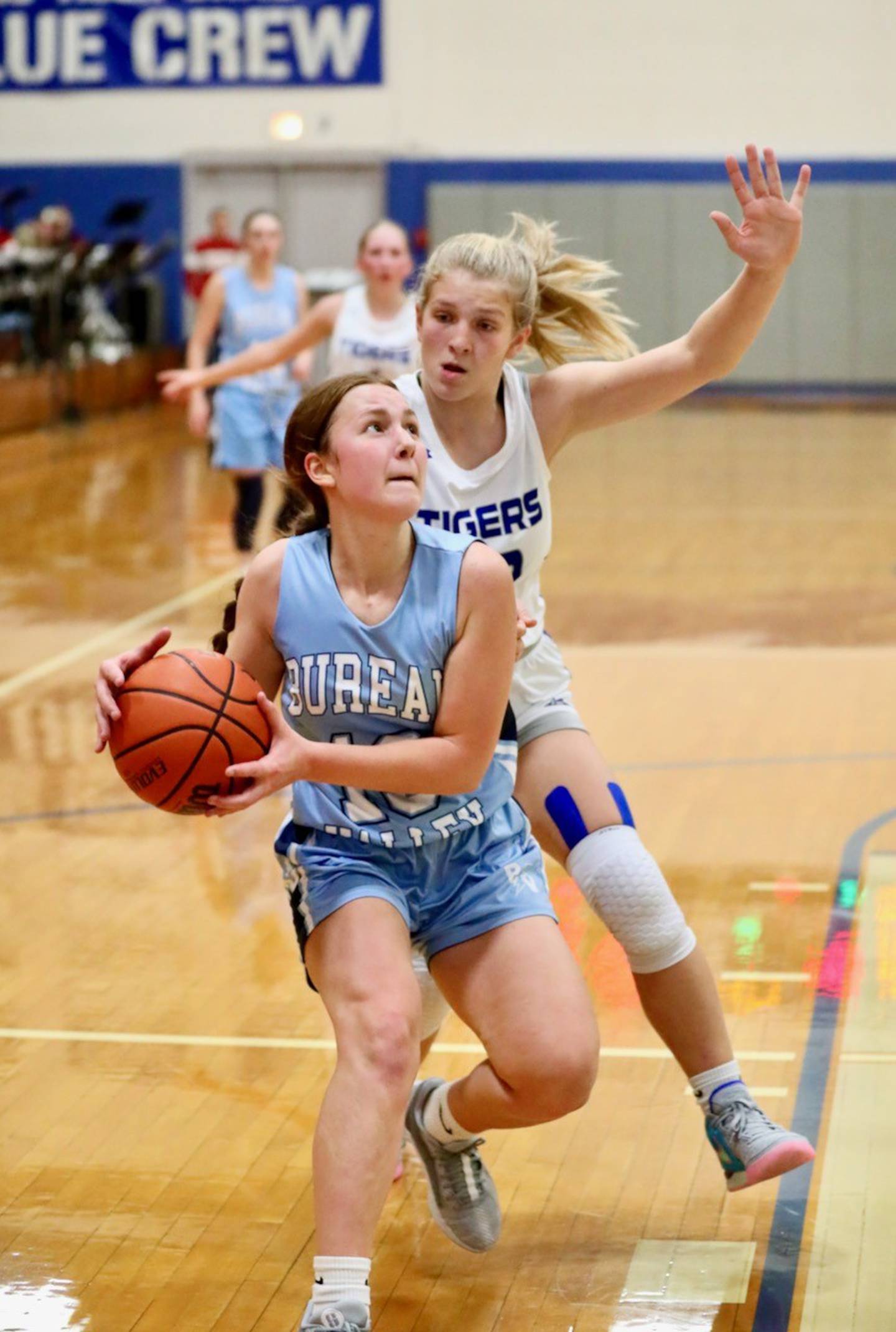 Bureau Valley freshmen Libby Endress gets past Princeton's Reese Reviglio for a layup in the second half of Monday's game at Prouty Gym. Endress scored 15 points to lead the Storm to a 55-45 win.