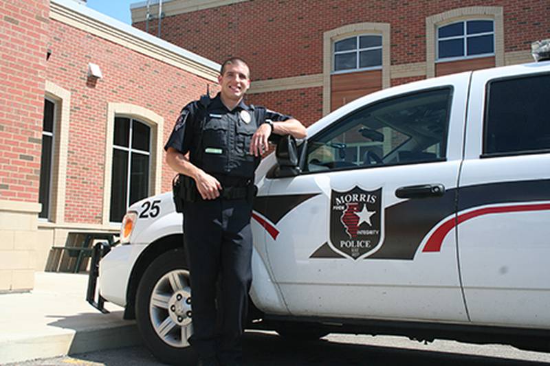 Patrick Funk has already begun working for the Morris Police Department as one of two new officers for the department. Scott Evans is still attending police academy in Cook County and was not present for this photo.