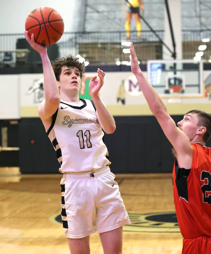 Sycamore's Jake Shipley shoots over Sandwich's Chance Lange during their game Friday, Nov. 24, 2023, in the Leland G. Strombom Holiday Tournament at Sycamore High School.