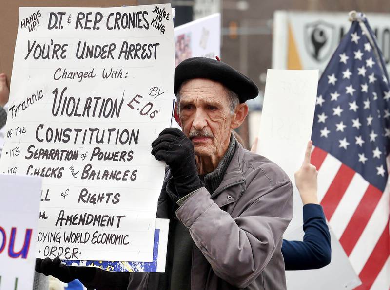 Protesters of all ages assembled Saturday, April 5, 2025, for a Hands Off! rally at Memorial Park on the corner of First Street and Lincoln Highway in DeKalb. The group gathered to protest against various policies of President Donald Trump and his administration.