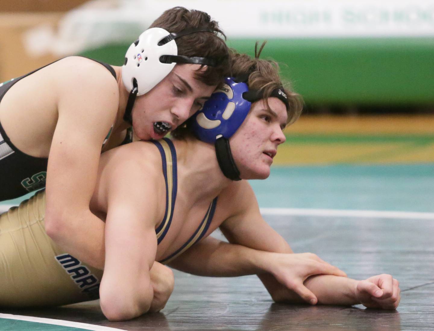 Seneca's Nate Othon controls the action against Marquette's Maclean Rinearson, in the 138-pound weight class during a triangular wrestling meet on Wednesday Jan. 12, 2022 in Seneca.