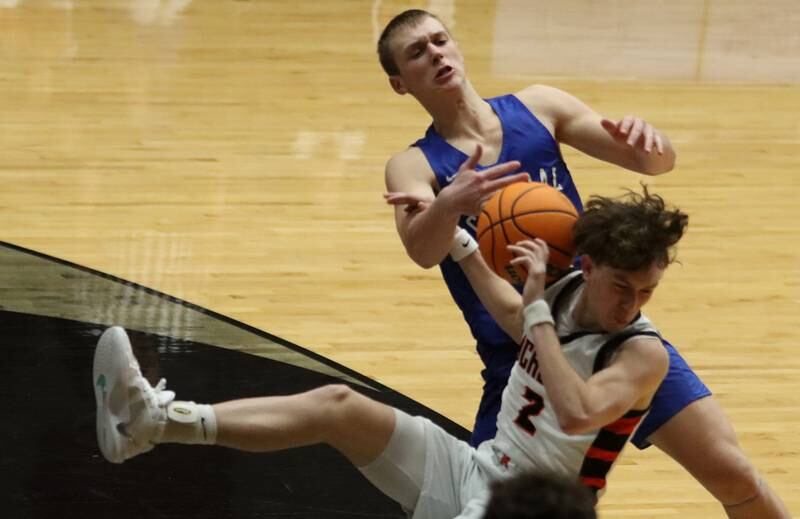Burlington Central’s Jacob Johnson, back, collides with McHenry’s Dayton Warren in varsity boys basketball on Tuesday, Feb. 4, 2025, at  McHenry High School  in McHenry.