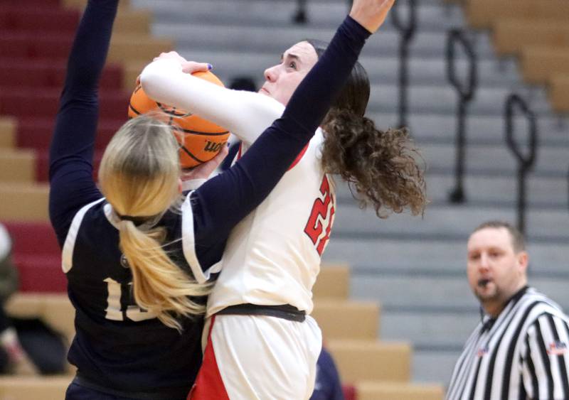 Huntley’s Luca Garlin shoots against Cary-Grove’s Malaina Kurth in varsity girls basketball on Monday, Feb. 2, 2026, at Huntley High School in Huntley.