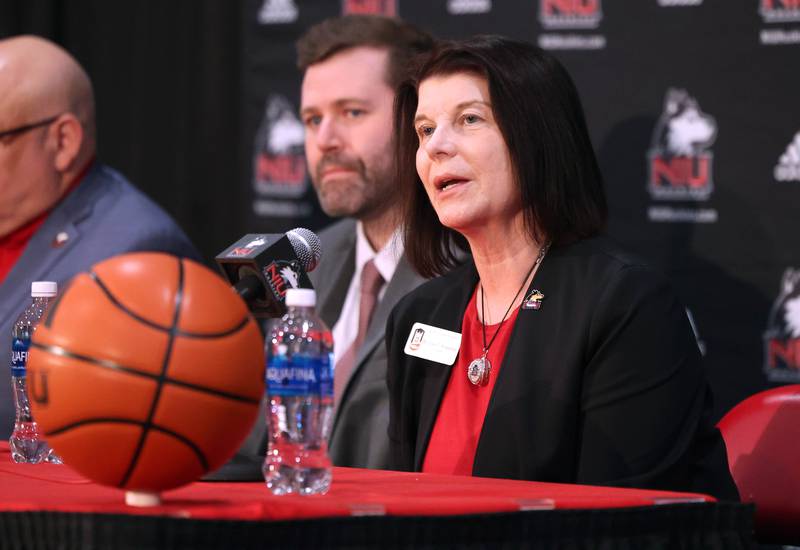 Northern Illinois University President Lisa Freeman talks about the qualifications of new men’s head basketball coach Matt Majkrzak (left) Tuesday, March 24, 2026, during a press conference introducing him in the Convocation Center at NIU in DeKalb.