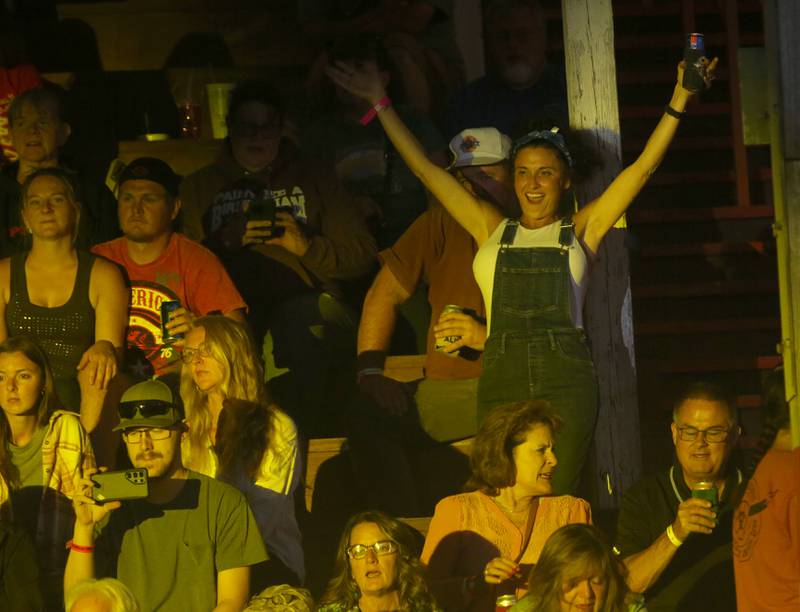A fan dances to music by Confederate Railroad during the 103rd annual Marshall-Putnam Fair on Thursday, July 18, 2024 in Henry.