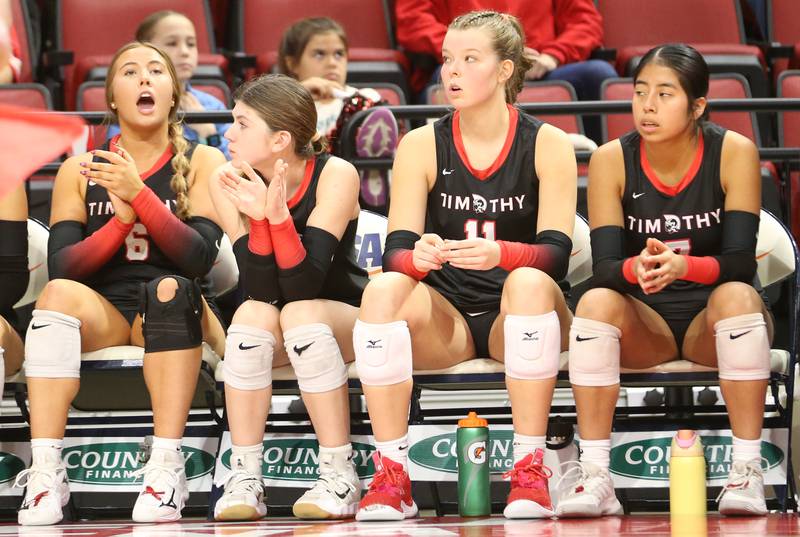 Timothy Christian players Anna Stoll, Carolina St. Charles, Ella Rickert and Maria Pozdol-Niego watch from the bench as they play Bloomington Central Catholic during the Class 2A State semifinal game on Friday, Nov. 15, 2024 at CEFCU Arena in Normal.