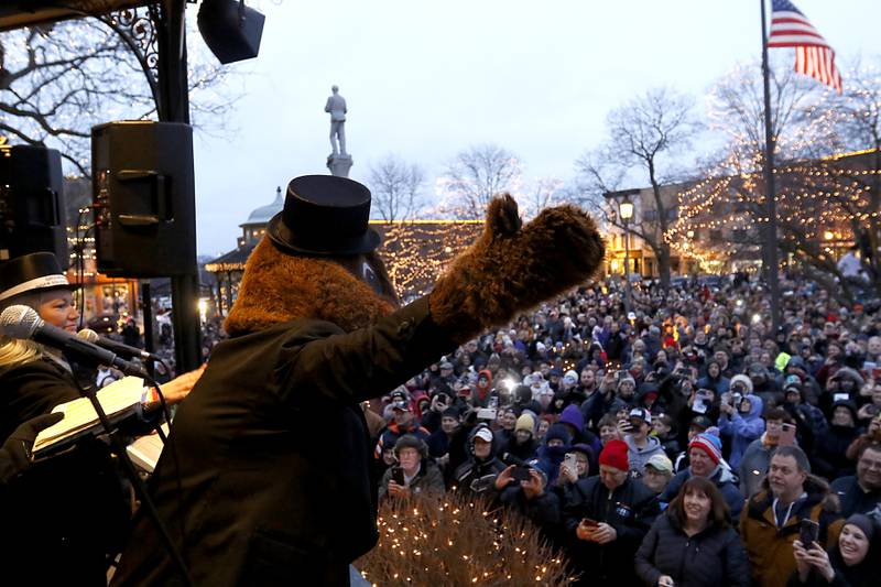 Woodstock Willie works the crowd Friday, Feb. 2, 2024, during the annual Groundhog Day Prognostication on the Woodstock Square.