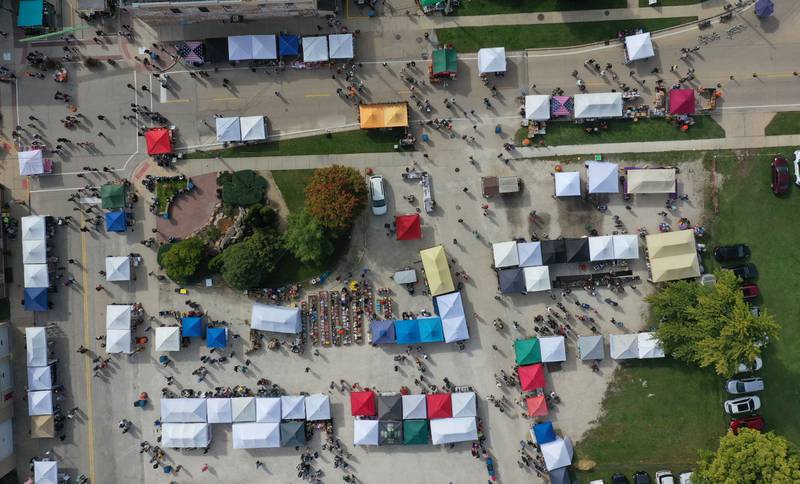 Vendors fill the parking lot area behind  the Utica Tornado memorial during the 53rd annual Burgoo on Sunday, Oct. 8, 2023 downtown Utica.