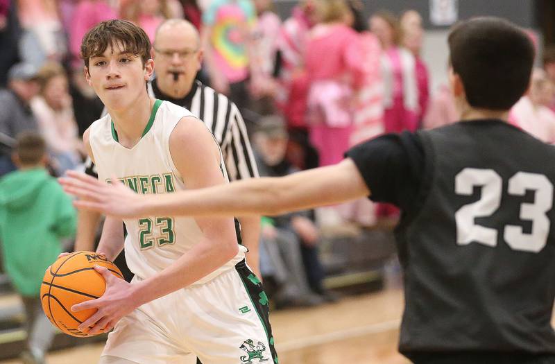Seneca's Brady Sheedy looks to pass the ball around Woodland's Nick Plesko on Friday, Feb. 14, 2025 at Seneca High School.