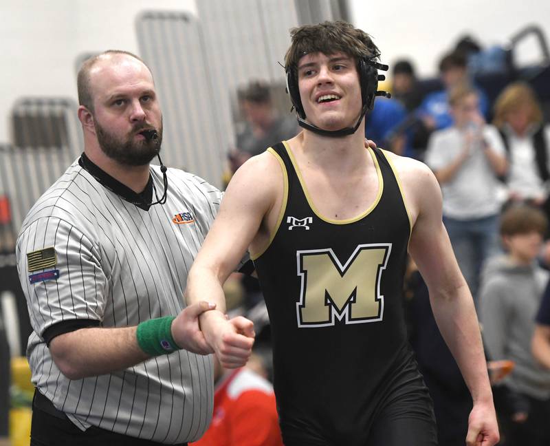 Polo's Micah Stringini smiles as he looks to the crowd after pinning Yorkville Christian's Kenny Fox in the championship match at 190 pounds at the Polo Wrestling Invitational on Saturday, Jan, 10, 2026 at Polo High School.
