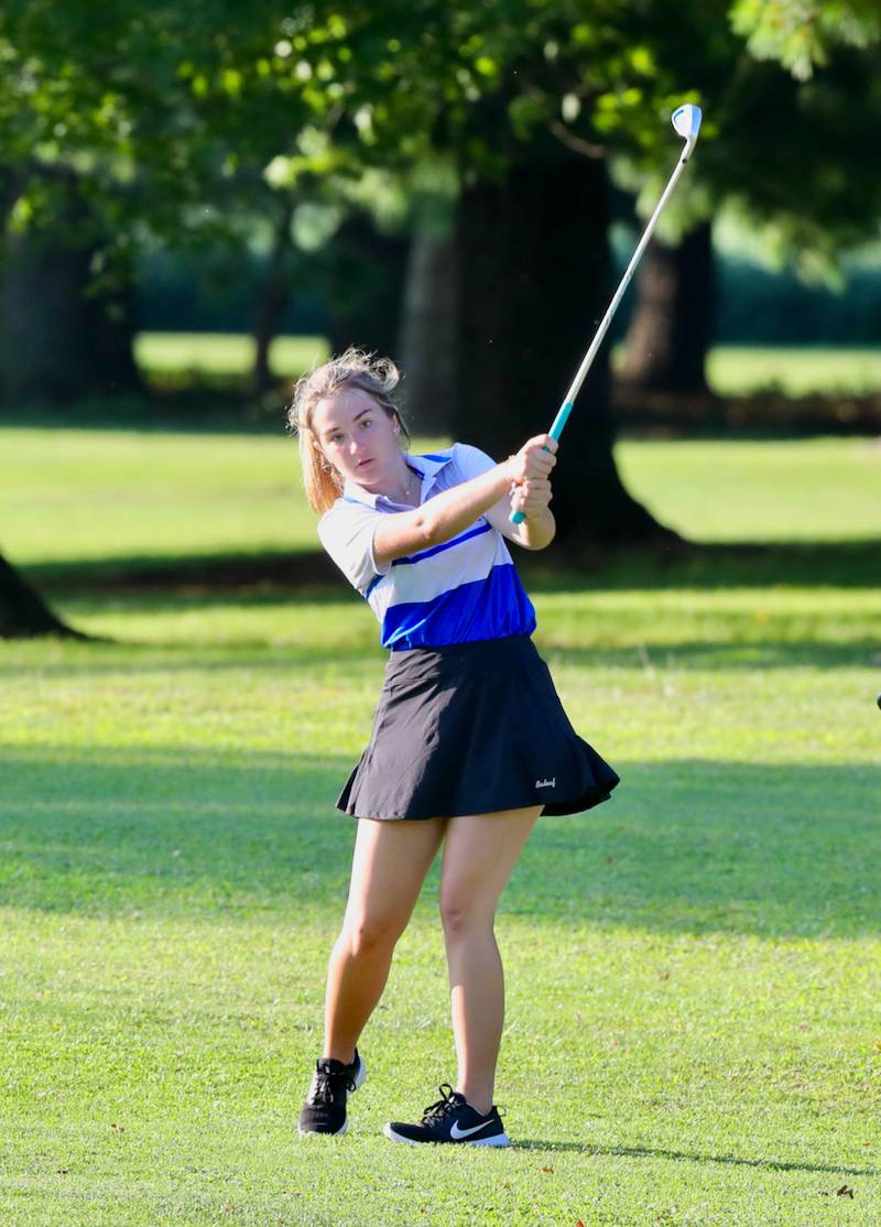 Princeton's Halli Peterson watches her iron shot Thursday a Wyaton Hills.