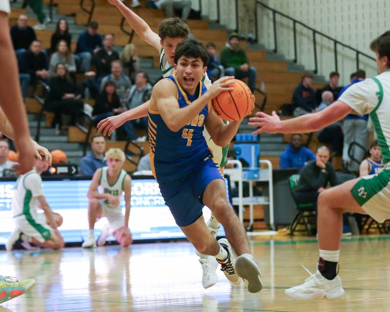Lyon's Josh Gutierrez (4) drives down the lane during their basketball game between Lyons at York. Jan 10, 2025 in Elmhurst.