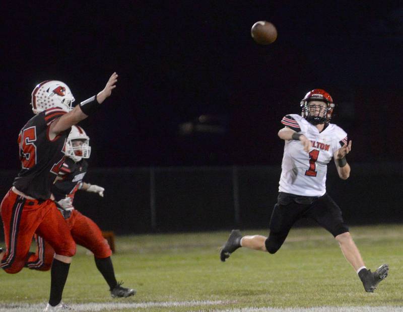 Fulton quarterback Braedon Meyers rolls out to pass the ball against Forreston on Friday, Sept. 12, 2025 in Forreston.