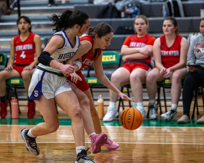 Audrey Arambula (5) of Streator dribbles  ball as Parker Twait (25) of Serena defends on Monday, November 17, 2025 at Seneca High School in Seneca.