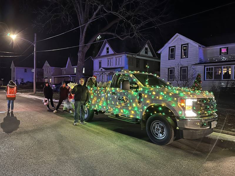 Light-adorned floats drive down Main Street in the 23rd annual Jingle Bell Parade during the Genoa Area Chamber of Commerce's annual Celebrate the Season holiday event on Dec. 6, 2024, in downtown Genoa.