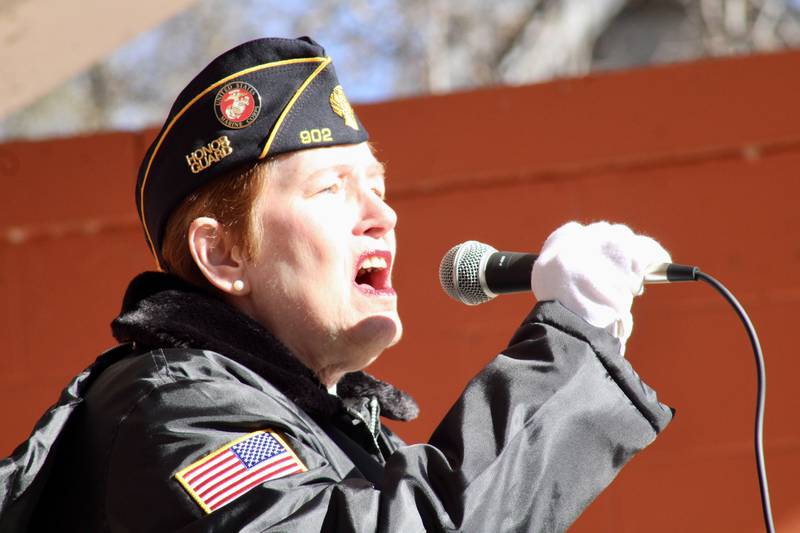 Theresa Heffelfinger sings the national anthem during a Veterans Day observance Friday, Nov. 11, 2022, at Veterans Memorial Park in Rock Falls.