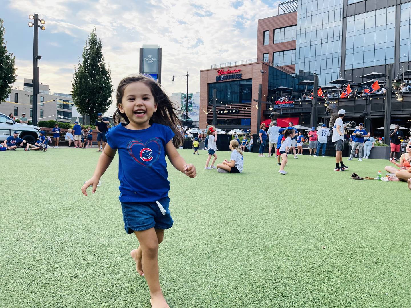 St. Charle 3-year-old Arlie Robken frolicking at Wrigley Field in Chicago.