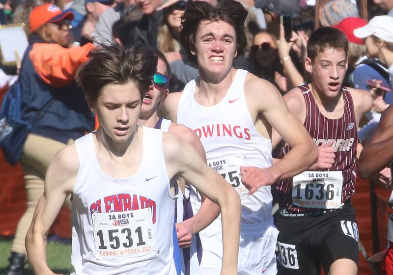 Glenbard South's Tom Jochum, Benet Academy's Charlie Phelan and Morris's Cuyler Swanson compete in the Class 2A State Cross Country race on Saturday, Nov. 4, 2023 at Detweiller Park in Peoria.