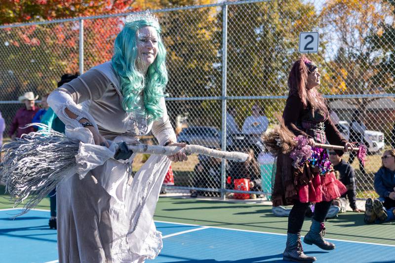 The “Hocus Pocus Hags” dance at the annual trick or treat at Washington park on Saturday, October 26, 2024 in Peru.