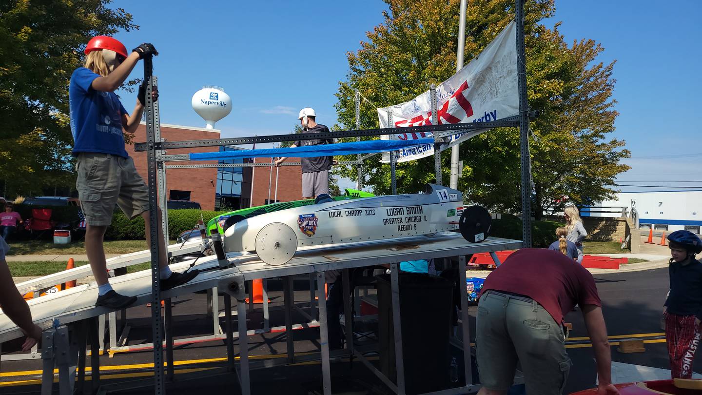 Logan Smith's soapbox car getting prepared to race on the Naperville track.