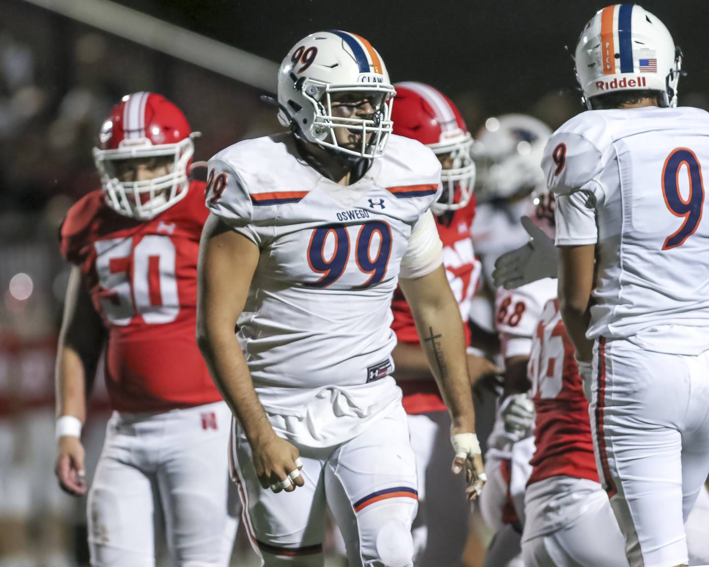 Oswego's Gianni Casurella (99) celebrates a defensive stop during football game between Oswego at Naperville Central  on Friday, Aug 29, 2025  in Naperville.