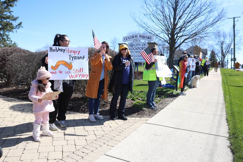 Protestors line East 9th Street outside Lockport City Hall at the No Kings rally on Saturday, March 28, 2026 .