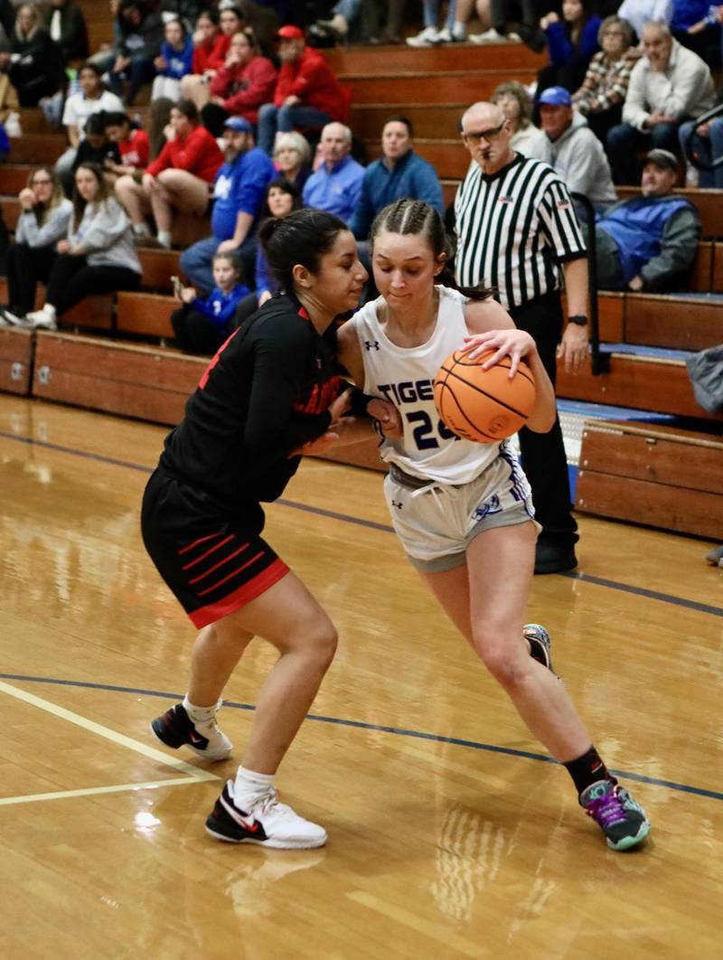 Princeton's Keighley Davis drives on Hall's Natalia Zamora Thursday night at Prouty Gym. The Tigresses won 34-30.