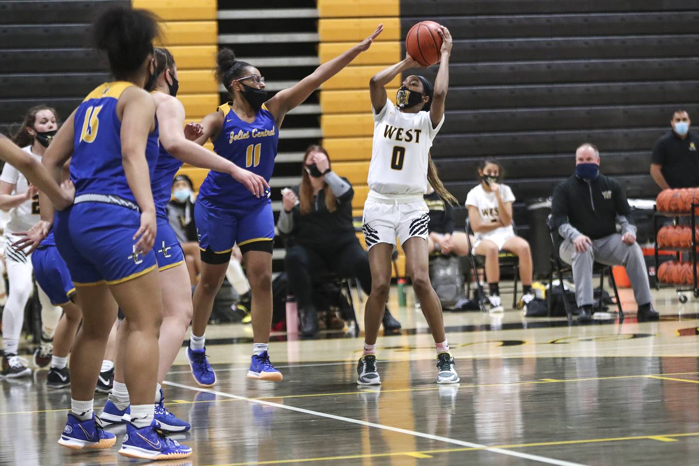 Joliet West's Lisa Thompson pulls up for a jump shot on Tuesday, Feb. 16, 2021, at Joliet West High School in Joliet, Ill. The Tigers defeated the Steelmen 49-36.