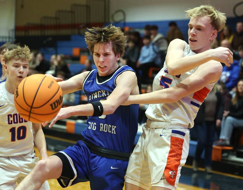 Hinckley-Big Rock's Harrison Nier and Genoa-Kingston's Blake Ides go after a rebound Tuesday, Jan. 6, 2026, during their game at Genoa-Kingston High School.