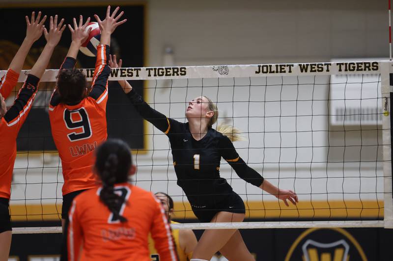 Joliet West’s Ava Grevengoed flips over a shot against Lincoln-Way West on Tuesday, Sept. 12, in Joliet.